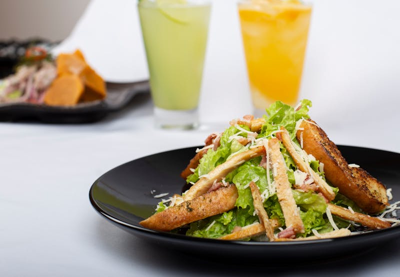 Caesar salad with croutons and parmesan shavings